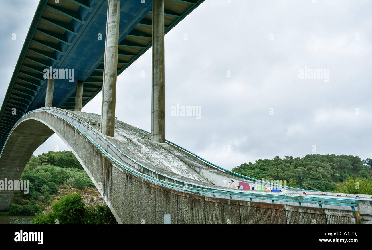 Motorway bridge over the river, in a green landscape. Stock Photo