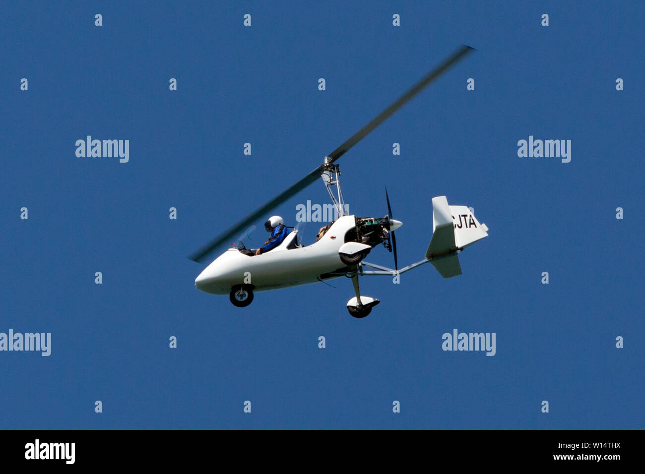 Autogyro, flying,over,The Needles,Round the Island Yacht Race, Cowes, Isle of Wight,England, 29 June 2019,Ken Wallis, Stock Photo
