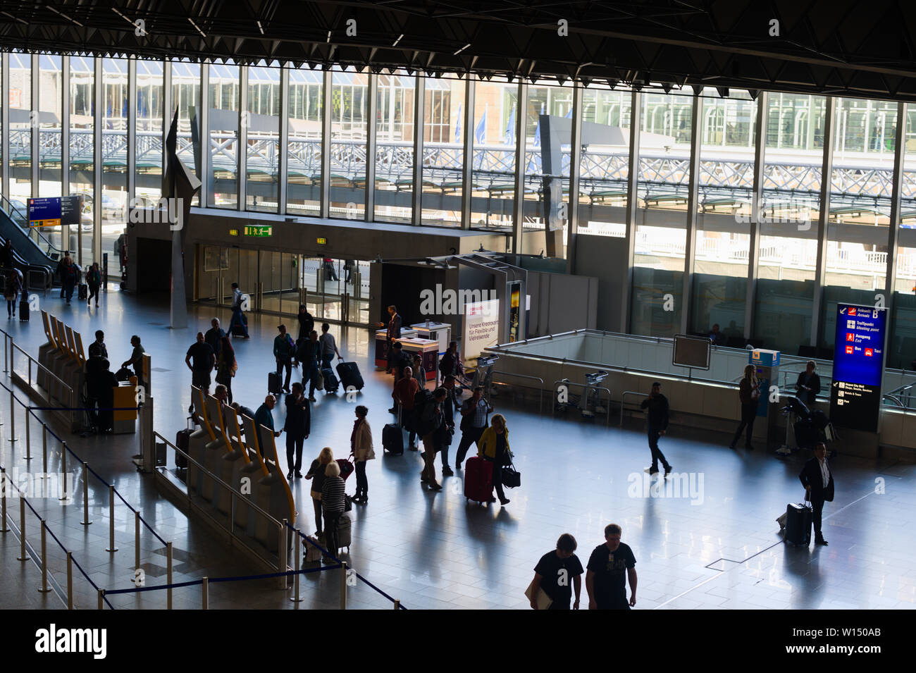 Passengers at Frankfurt International Airport in Frankfurt am Main, Germany Stock Photo