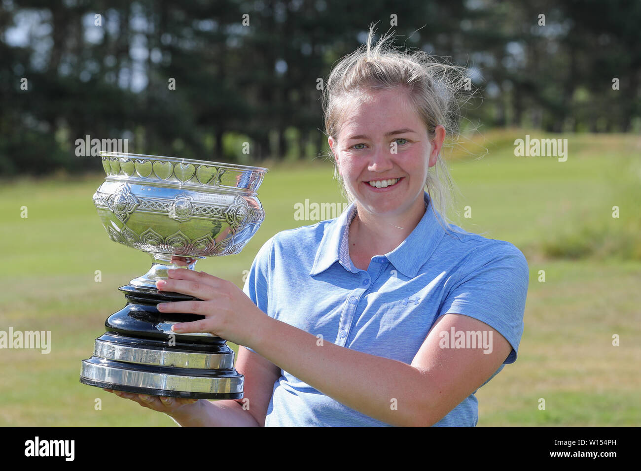 Troon, Scotland, UK. 30th June 2019. One the final round of the Scottish Women's Amateur Championship Clark Rosebowl the Championship Cup was won by KIMBERLEY BEVERIDGE from Aboyne Golf Club and the Silver Plate was won by MEGAN ROBB from Banchory Golf Club.Image of Kimberley Beveridge with the Challenge Cup ytrophy Credit: Findlay/Alamy Live News Stock Photo