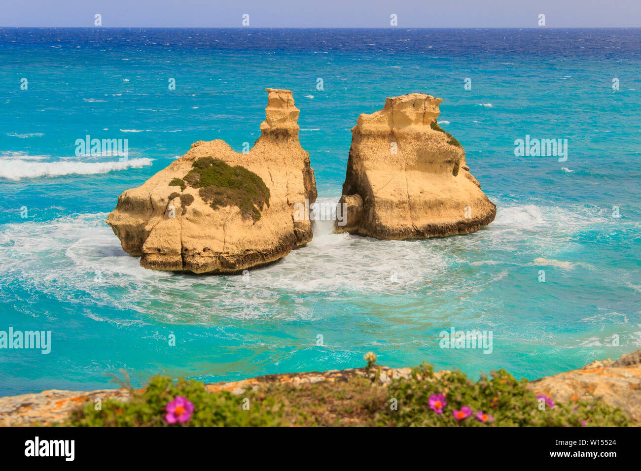 The most beautiful coast of Apulia: Torre Dell'Orso Bay, ITALY (Lecce).Typical seascape of Salento: view of the two stacks called The Two Sisters. Stock Photo