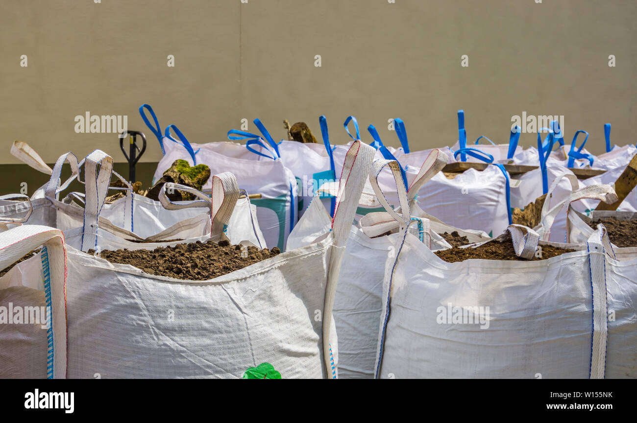 White big bags full with potting soil, horticulture and agriculture