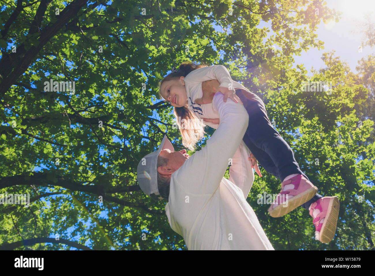 Father and daughter at park dancing and holding hands Stock Photo - Alamy