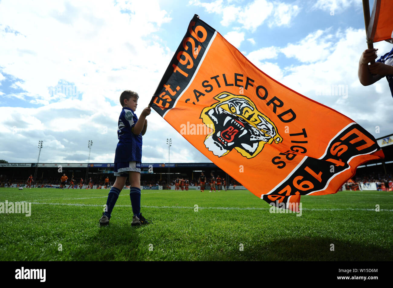A mascot waves a flag before the Betfred Super League match at the Mend-A-Hose Jungle, Castleford. Stock Photo