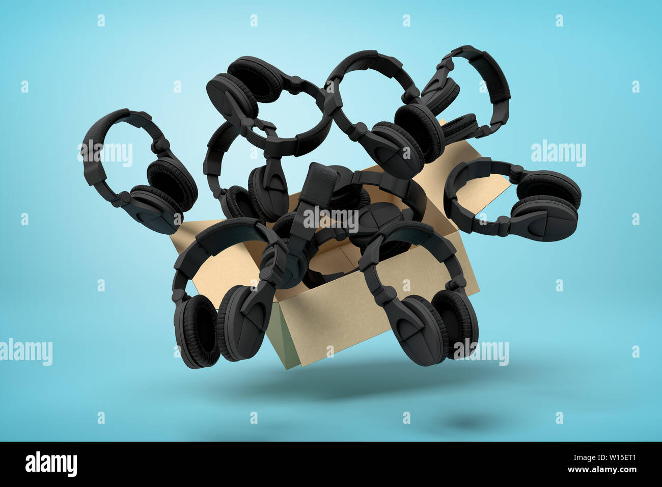 3d rendering of cardboard box in air full of black headphones which are flying out and floating outside on blue background. Stock Photo