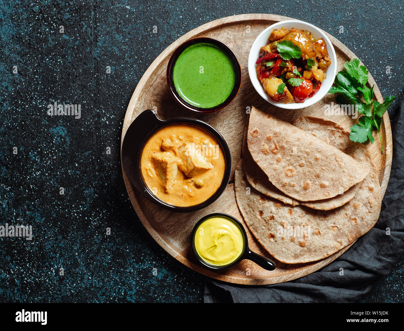 Indian cuisine dishes vegetable curry, shahi paneer, chapati, chutney