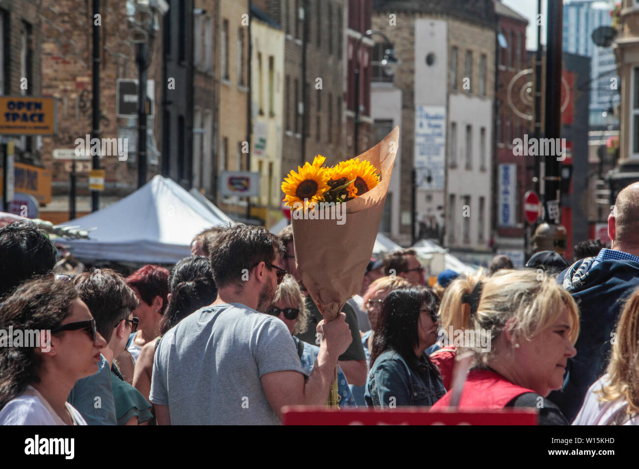 London, UK. 30th June, 2019. London enjoed a bit of a cooler weather today with temperatures showing 25 Max, people enjoying the sunshine in Bricklane.Paul Quezada-Neiman/Alamy Live News Credit: Paul Quezada-Neiman/Alamy Live News Stock Photo
