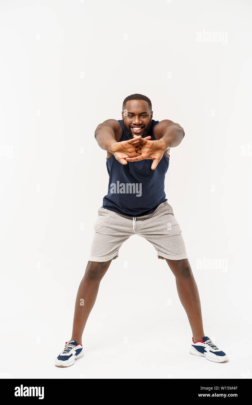 Happy african sportsman stretching hi-res stock photography and images ...