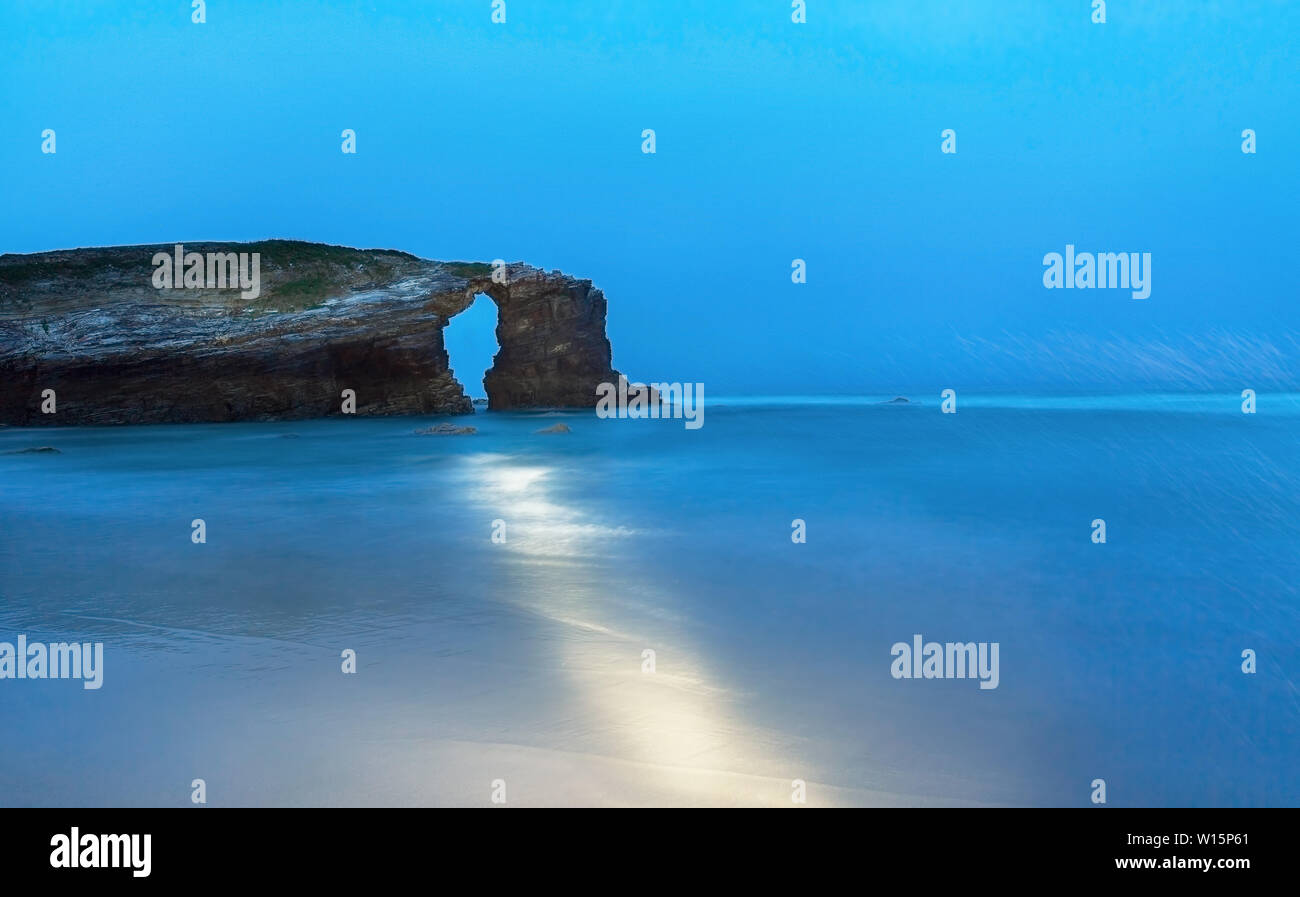 rock in the Bay of Biscay in the rain, Spain Stock Photo