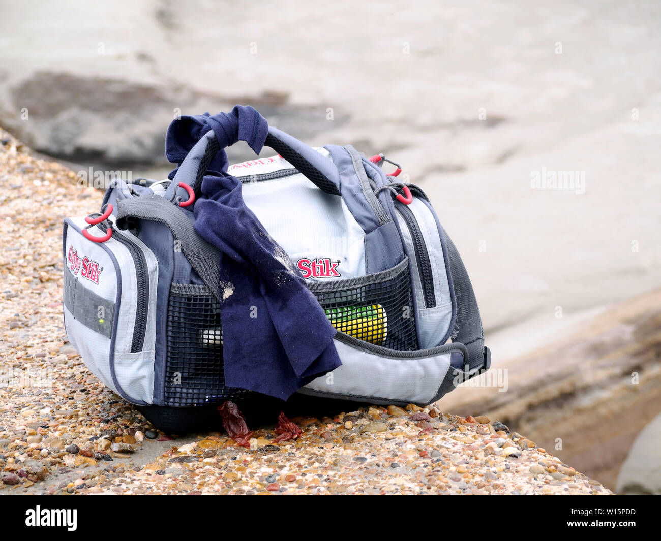 Ugly Stick brand soft fishing tackle box sitting on the South Jetty in Port  Aransas, Texas USA Stock Photo - Alamy