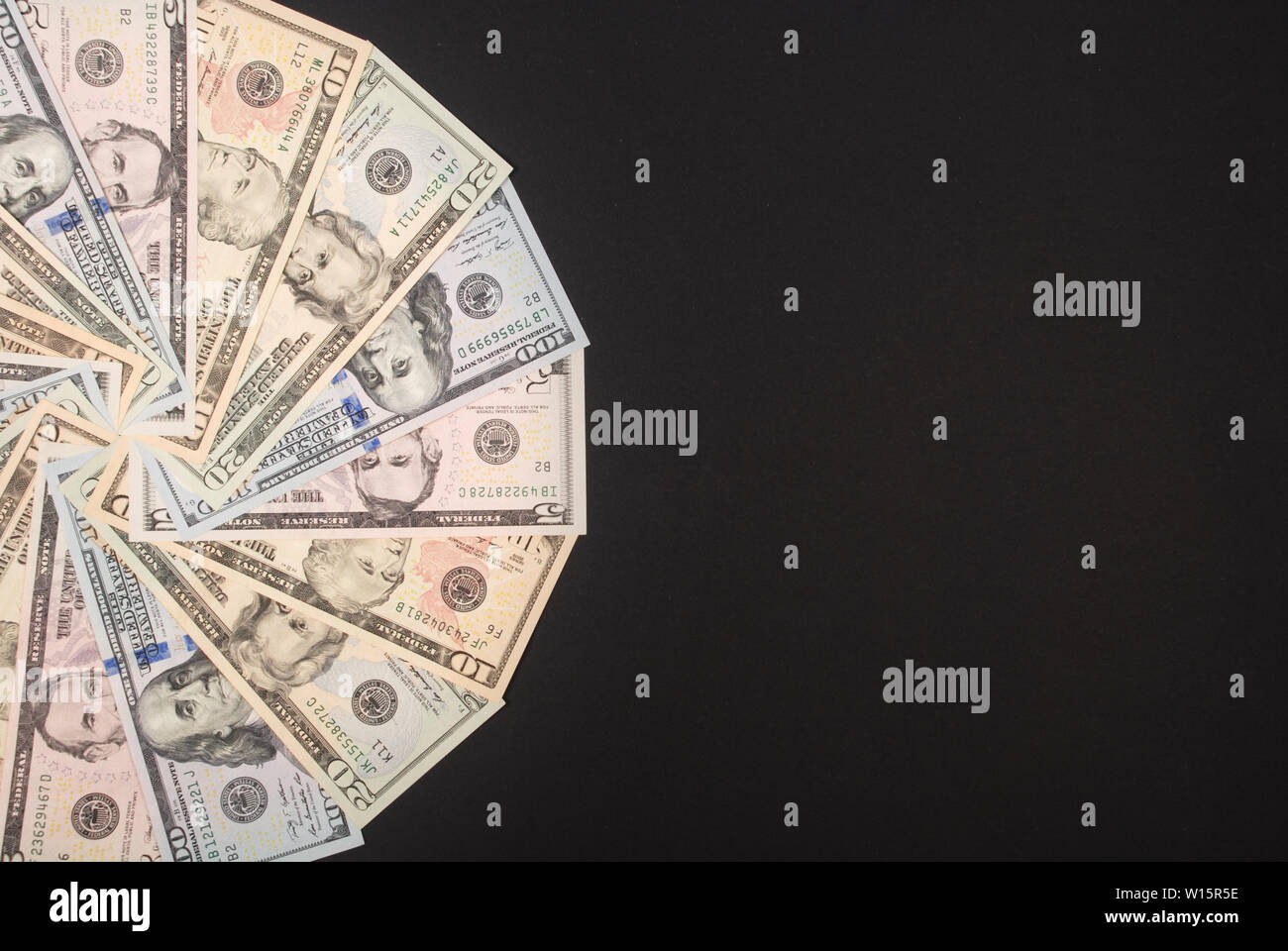 Mandala kaleidoscope from money. Abstract money background raster pattern repeat mandala circle. On black background. Stock Photo