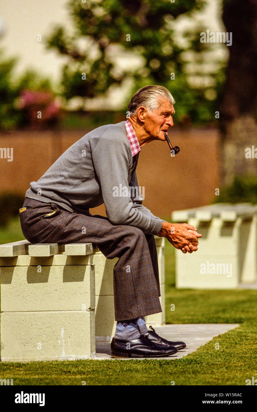 New Zealand, North Island, Rotorua. Elderly spectator at Rotorua bowling club. Lawn bowls. Photo taken November 1989. Photo: © Simon Grosset. Archive: Stock Photo