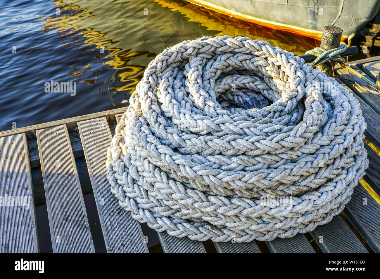 New thick rope for mooring ships and boats in port Stock Photo - Alamy