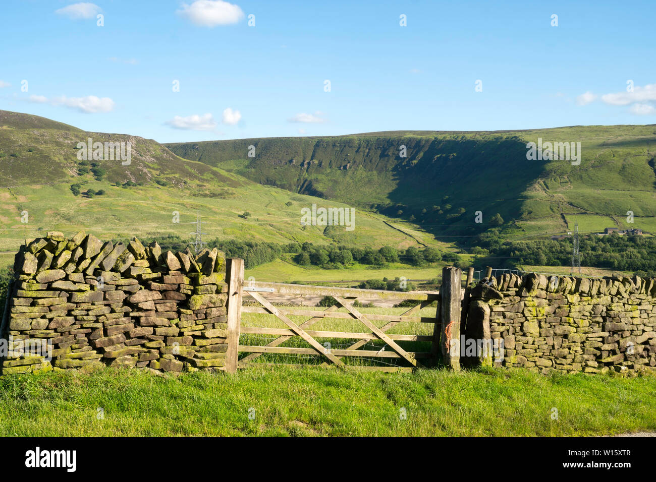 The Pennine Way runs above Torside Clough seen across the Longendale Valley in Crowden, Derbyshire, England, UK Stock Photo
