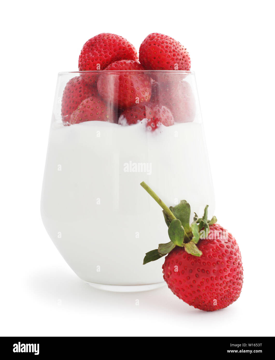 Yogurt and fresh berries strawberry studio isolated on white background Stock Photo
