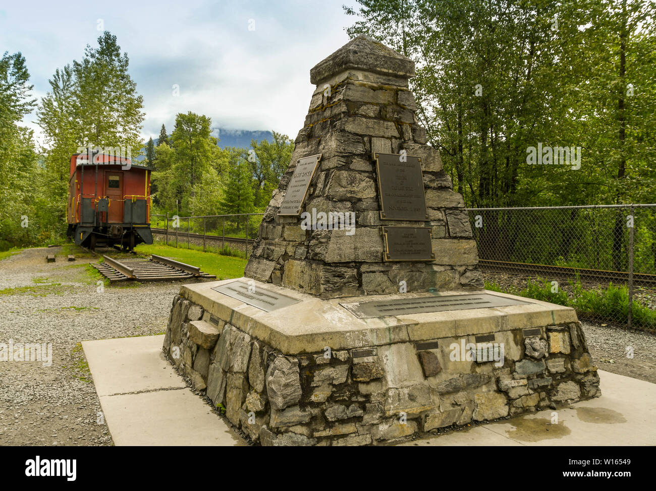 CRAIGELLACHIE, BRITISH COLUMBIA, CANADA - JUNE 2018: Stone memorial on the site where the last iron spike was hammered into the track to complete the Stock Photo