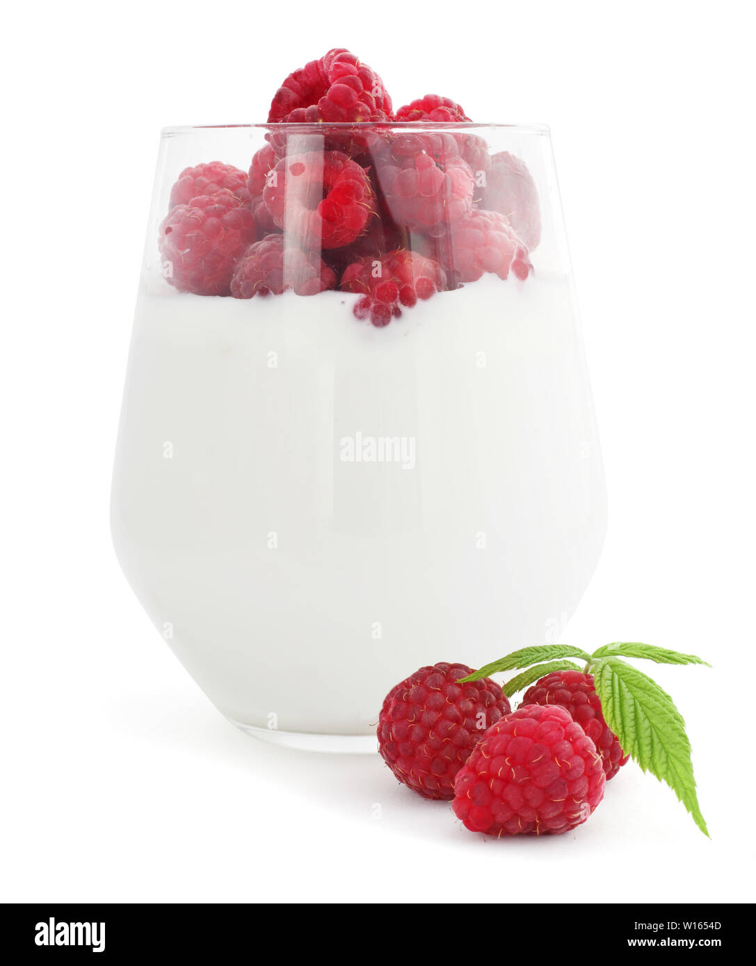 Yogurt and fresh berries raspberry studio isolated on white background Stock Photo