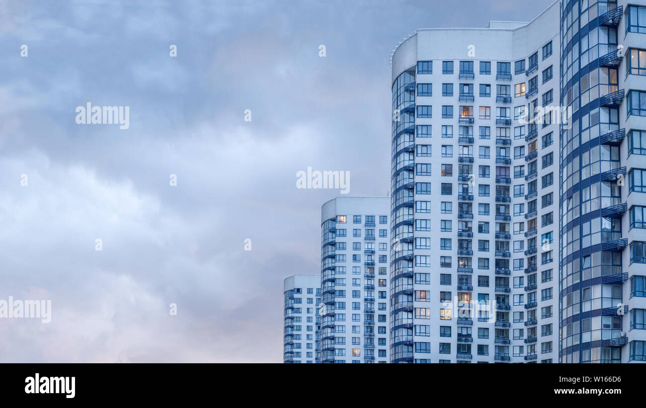 Real estate background. Ukrainian real estate market. Urban abstract background. Apartment building. Image of side view of big building with apparteme Stock Photo