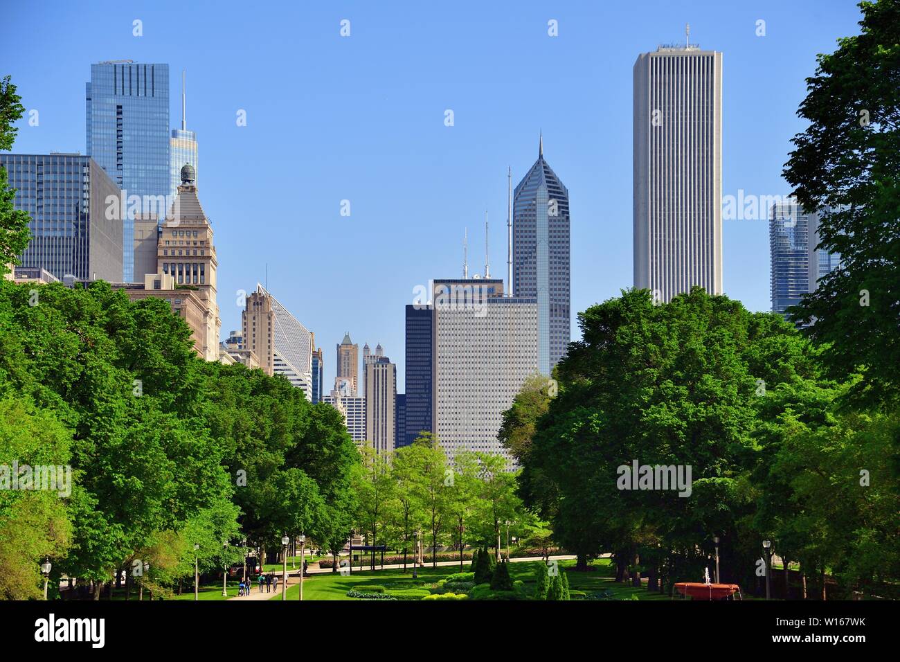 Chicago, Illinois, USA. A portion of the city skyline rises above the venerable facades of buildings along Michigan Avenue at far left. Stock Photo