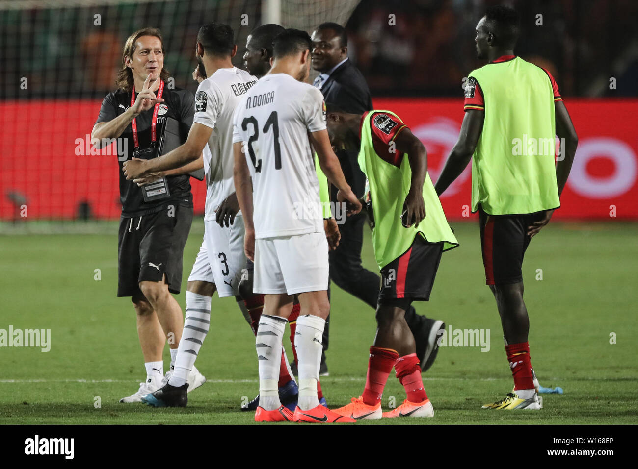 Cairo, Egypt. 30th June, 2019. Egypt assistant coach Michel Salgado greets players after the final whistle of the 2019 Africa Cup of Nations Group A soccer match between Egypt and Uganda at Cairo International Stadium. Credit: Omar Zoheiry/dpa/Alamy Live News Stock Photo
