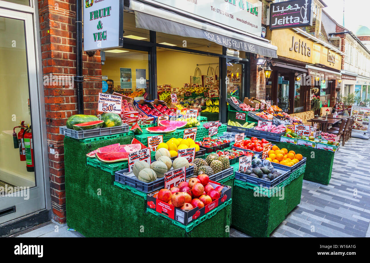 Colourful display of fruit and vegetables outside Boz, a traditional old-fashioned greengrocer in Woking town centre, Surrey, south-east England Stock Photo