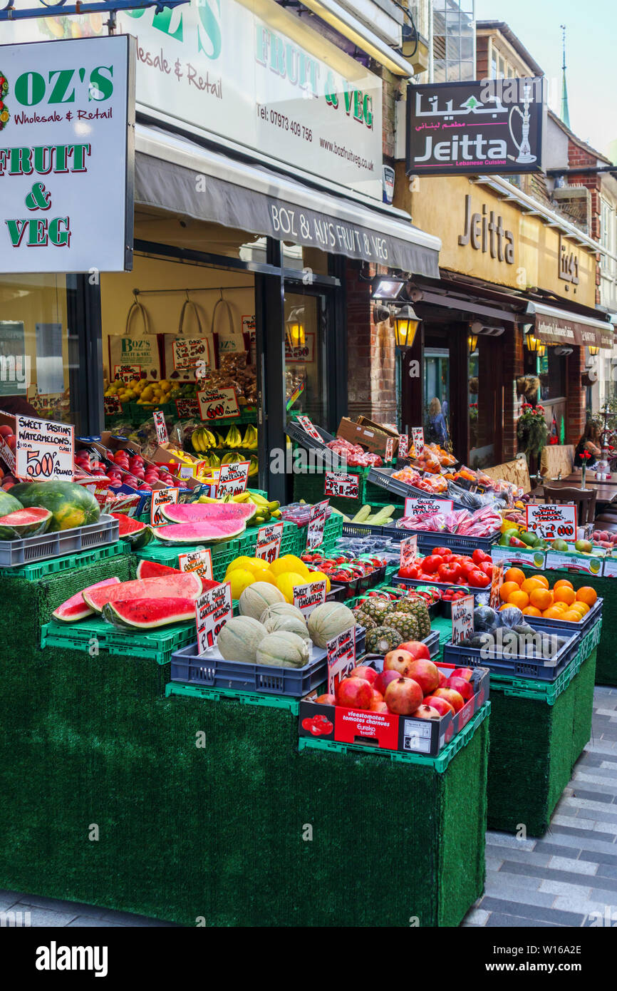 Colourful display of fruit and vegetables outside Boz, a traditional old-fashioned greengrocer in Woking town centre, Surrey, south-east England Stock Photo