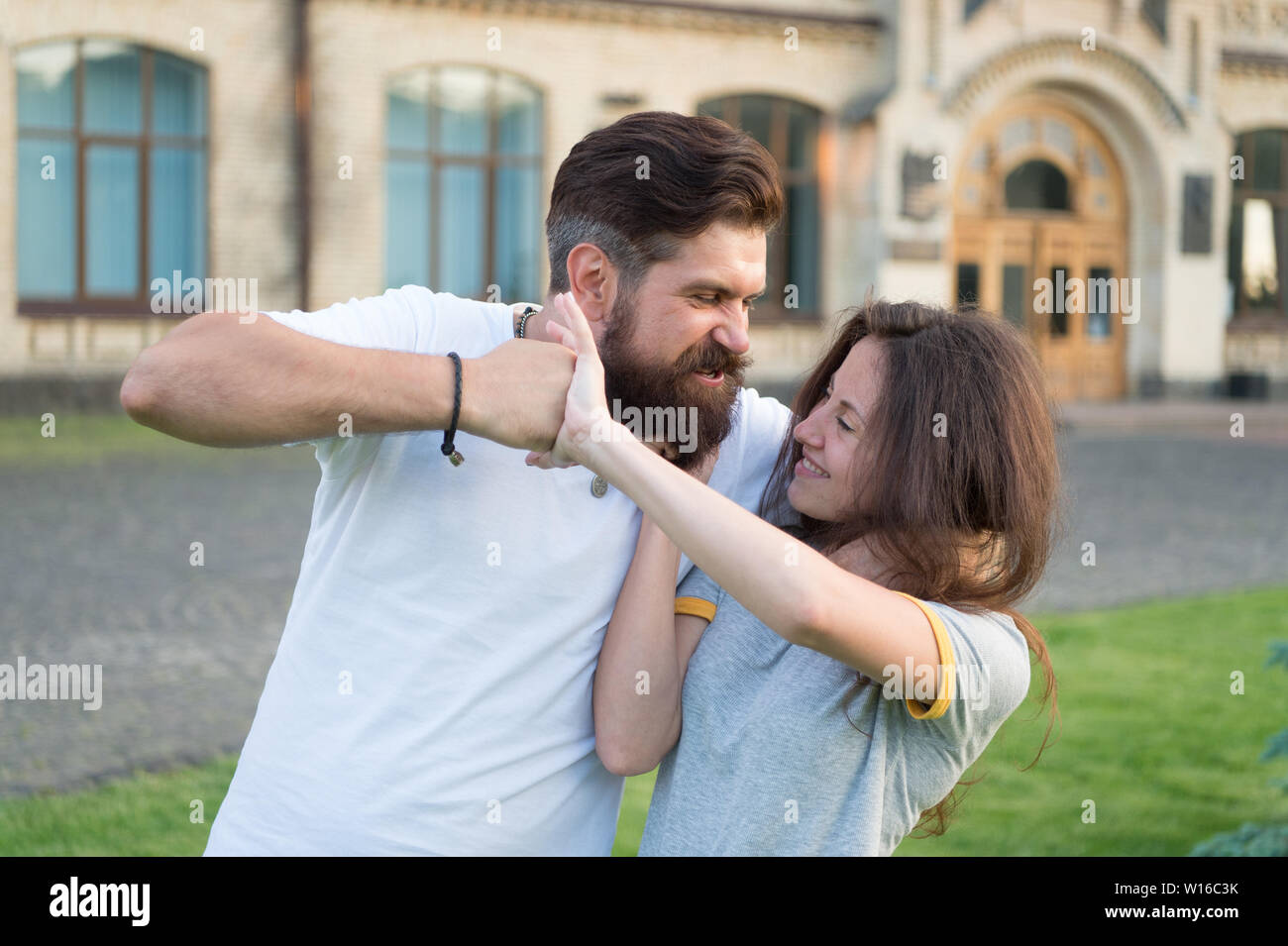 Taking a lot of abuse from him. Bearded man pushing girl using physical  abuse in public. Woman experiencing violence and abuse. Domestic violence  as a gender-based form of extreme human rights abuse