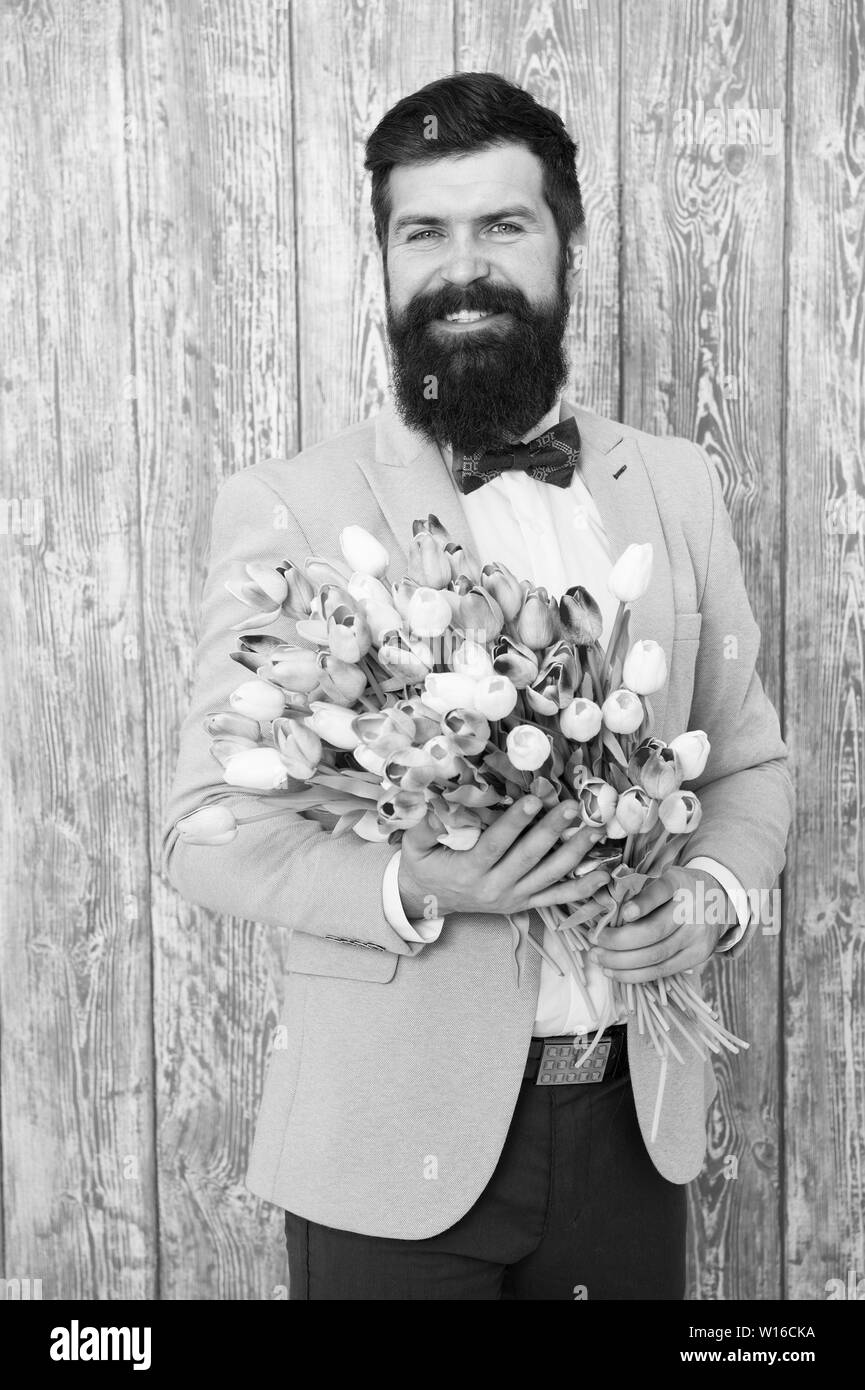 Unique flower arrangements. Spring gift. Bearded man hipster with flowers.  Flower for March 8. Love date. international holiday. Womens day. Bearded  man with tulip bouquet. Spring flower bouquet Stock Photo - Alamy, image size:865x1390