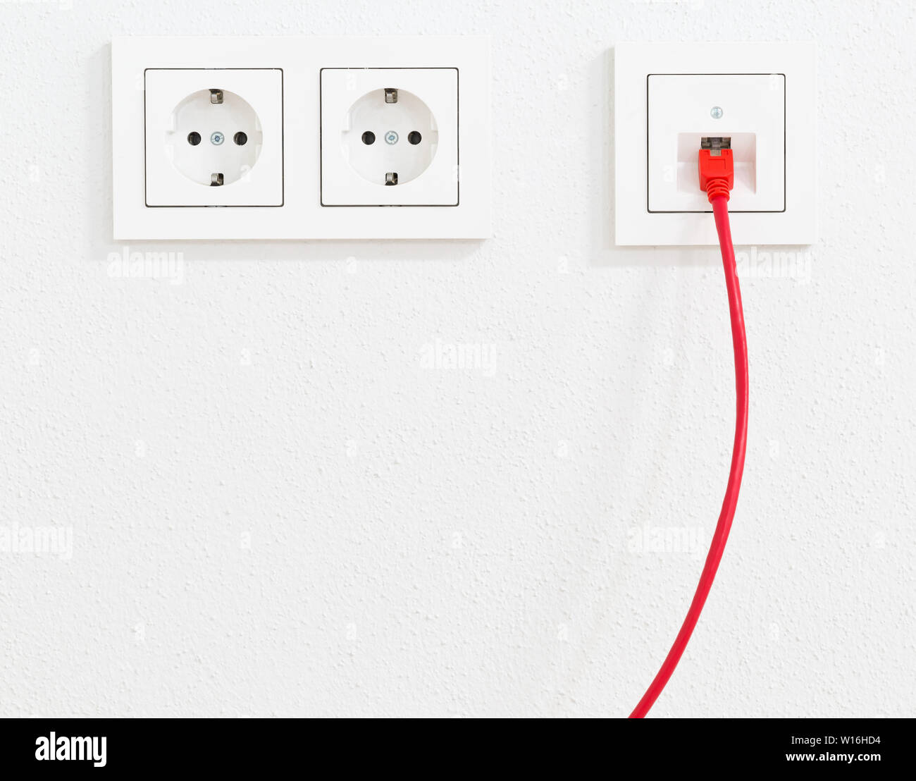 Red network cable in wall outlet for office or private home lan ethernet  connection with power outlets flat view on white plaster wall background  Stock Photo - Alamy