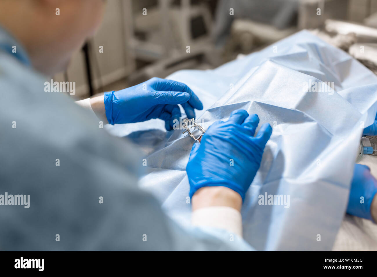 A professional ophthalmologist performs eye surgery with a microscope