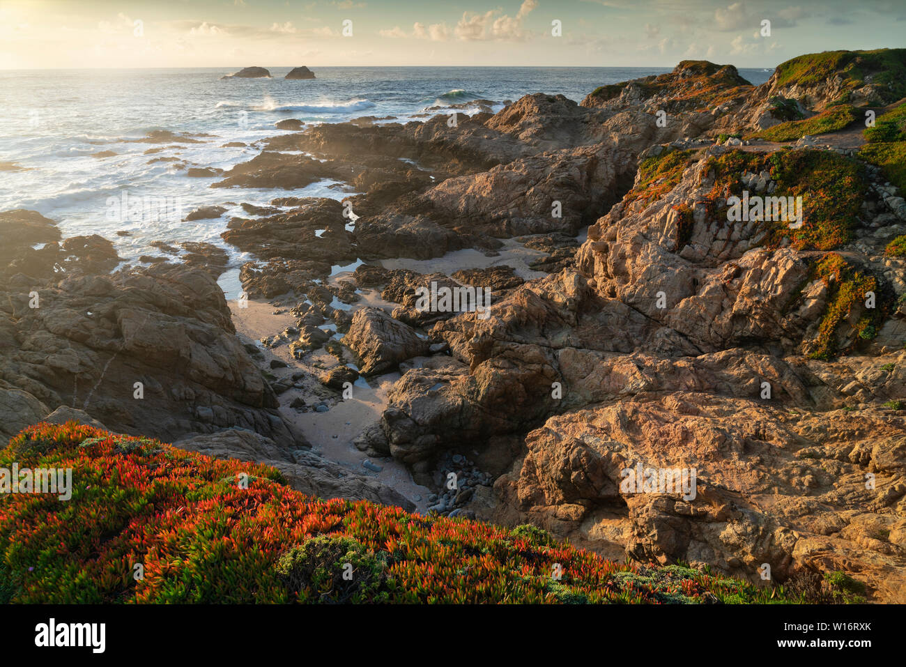 Rocky shore with sunset hi-res stock photography and images - Alamy