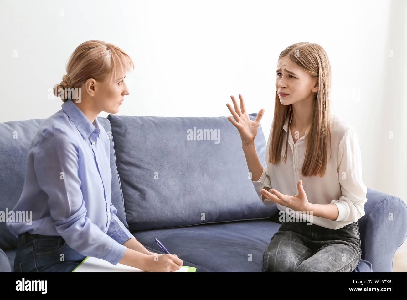 Female psychologist working with teenage girl in office Stock Photo Alamy