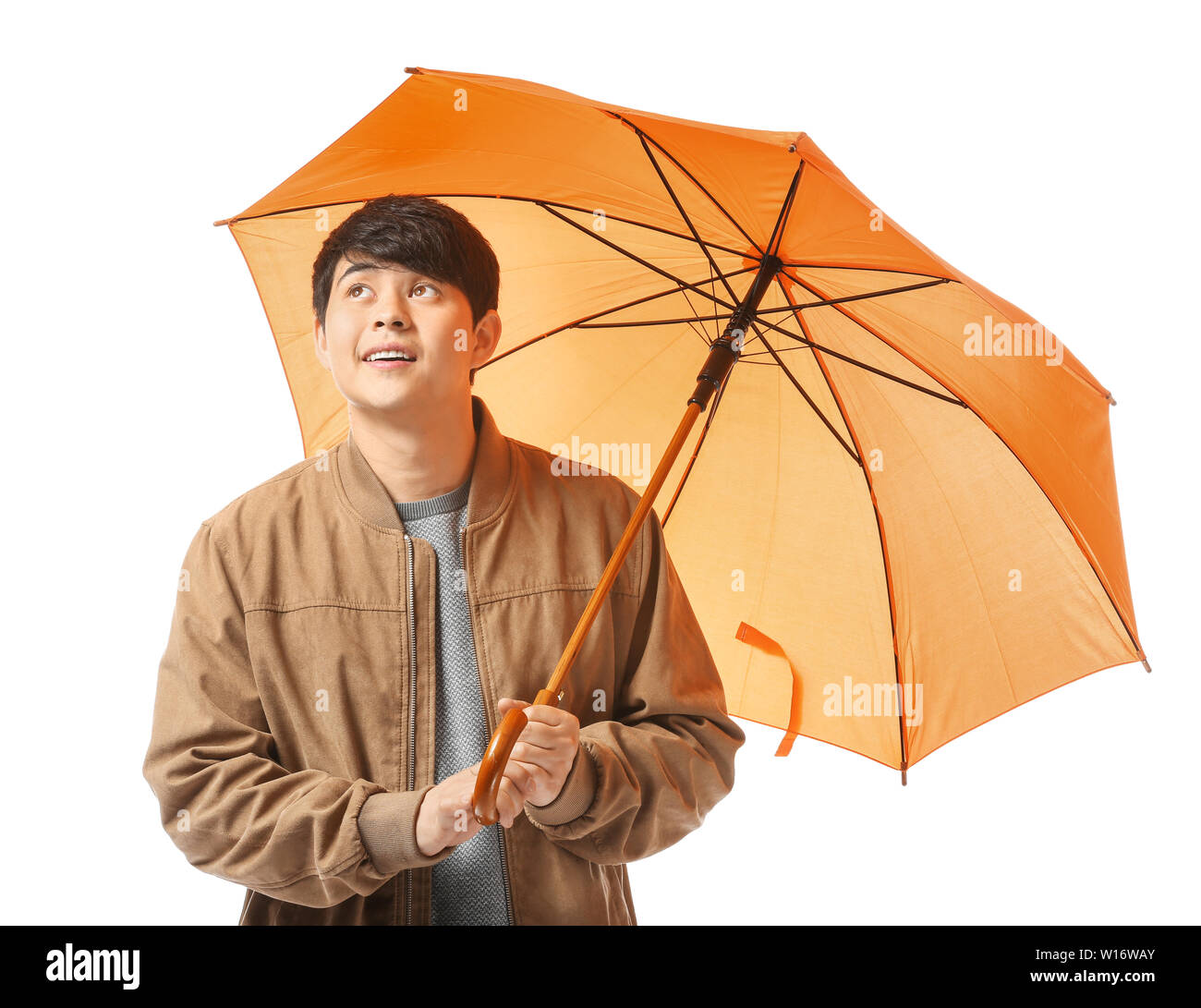 Handsome Asian man with umbrella on white background Stock Photo - Alamy