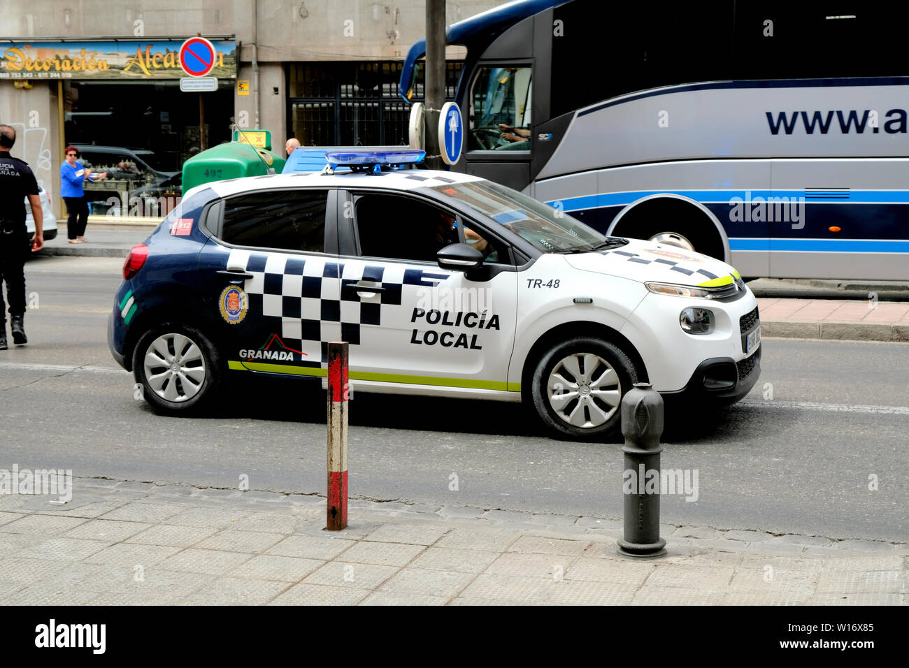 Local Granada police vehicle on the streets of Granada, Spain; law