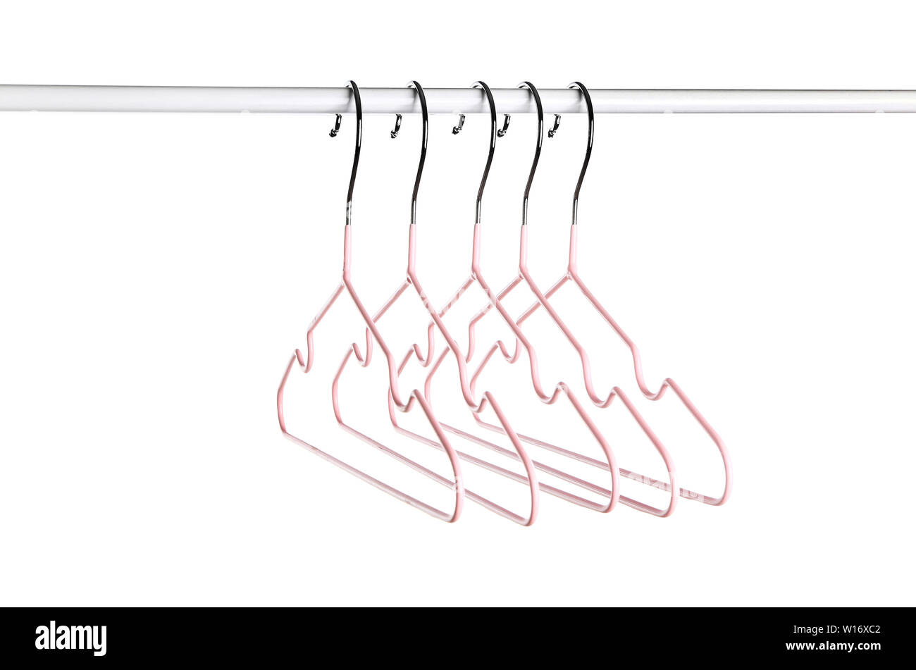 Rack with clothes hangers on white background Stock Photo - Alamy