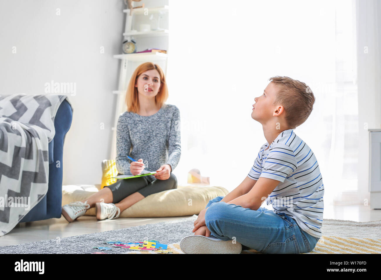 Little boy with autistic disorder at child psychologist's office Stock