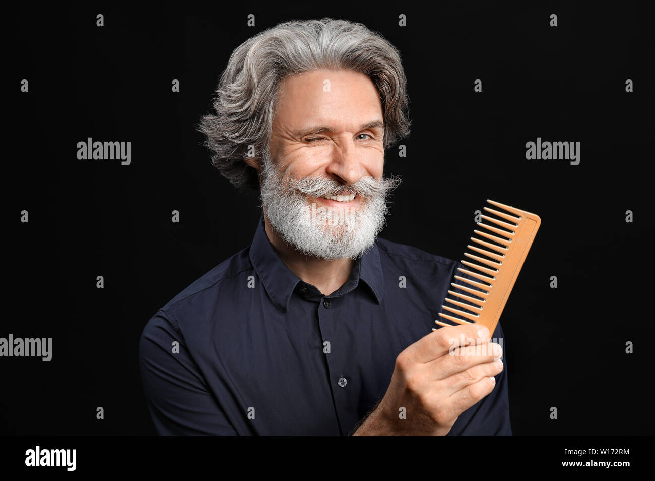 Mature Male Hairdresser On Dark Background Stock Photo 258926072