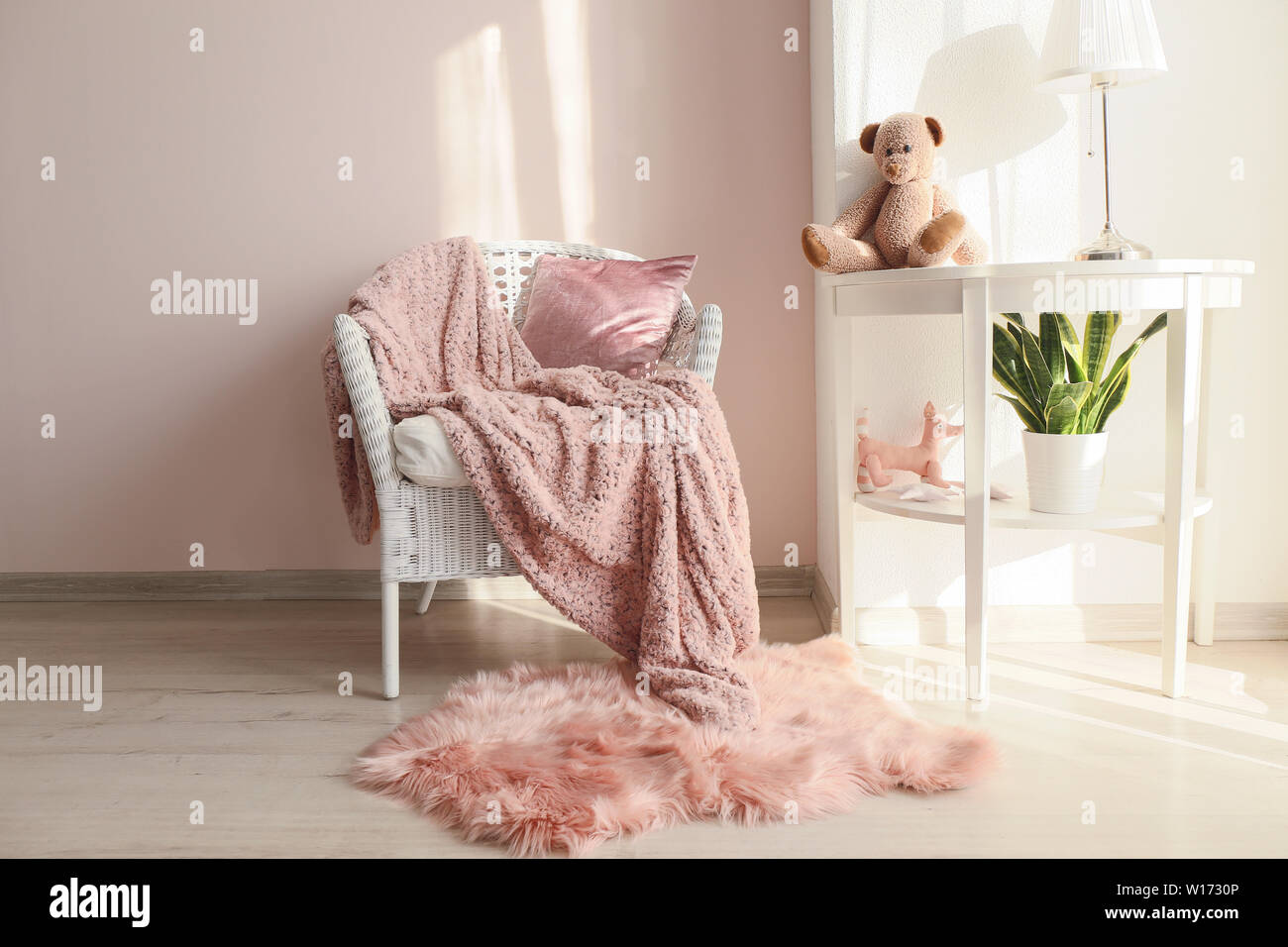 Interior of light modern room with comfortable armchair and table Stock ...