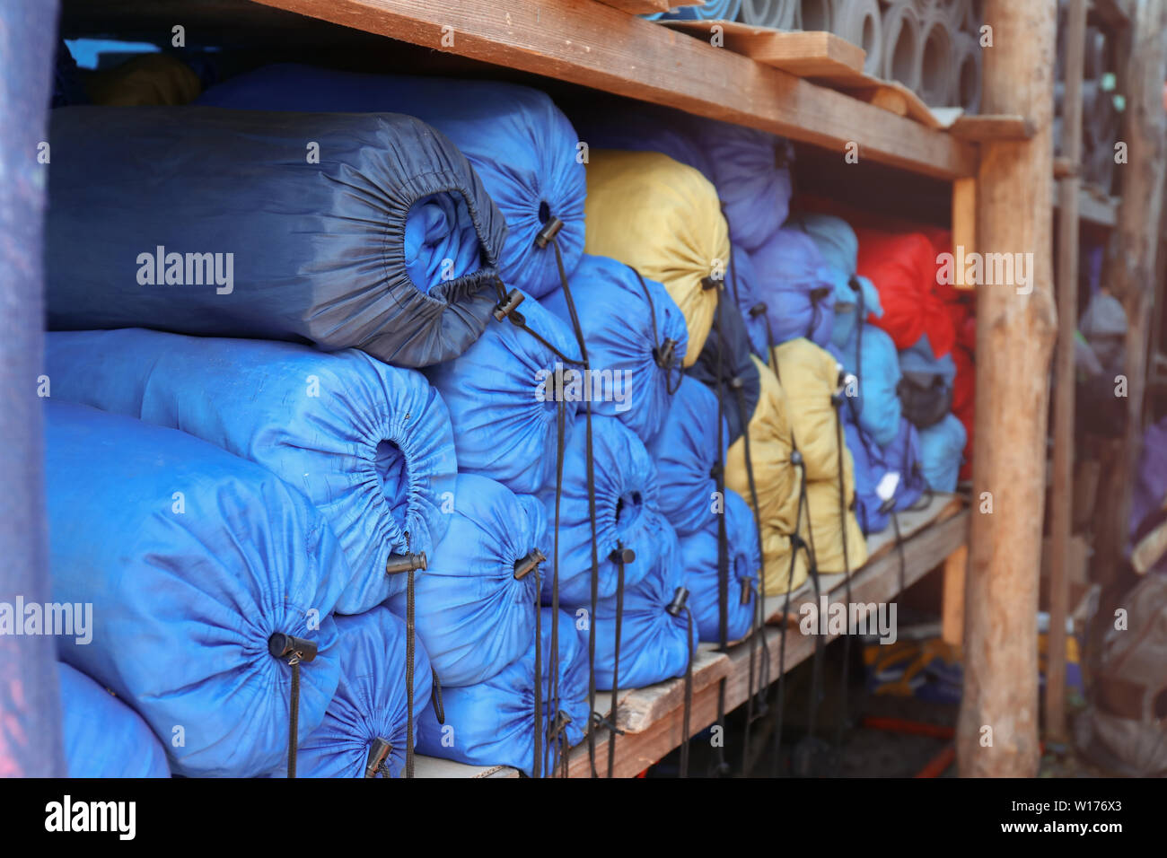 Sleeping bags on shelf in warehouse Stock Photo Alamy