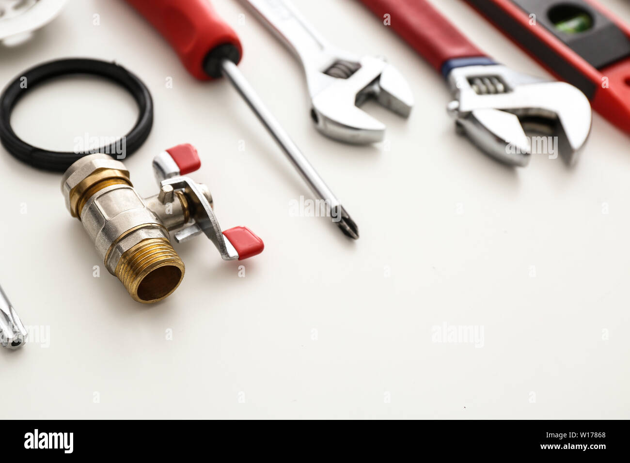 Plumbing items on white background Stock Photo - Alamy