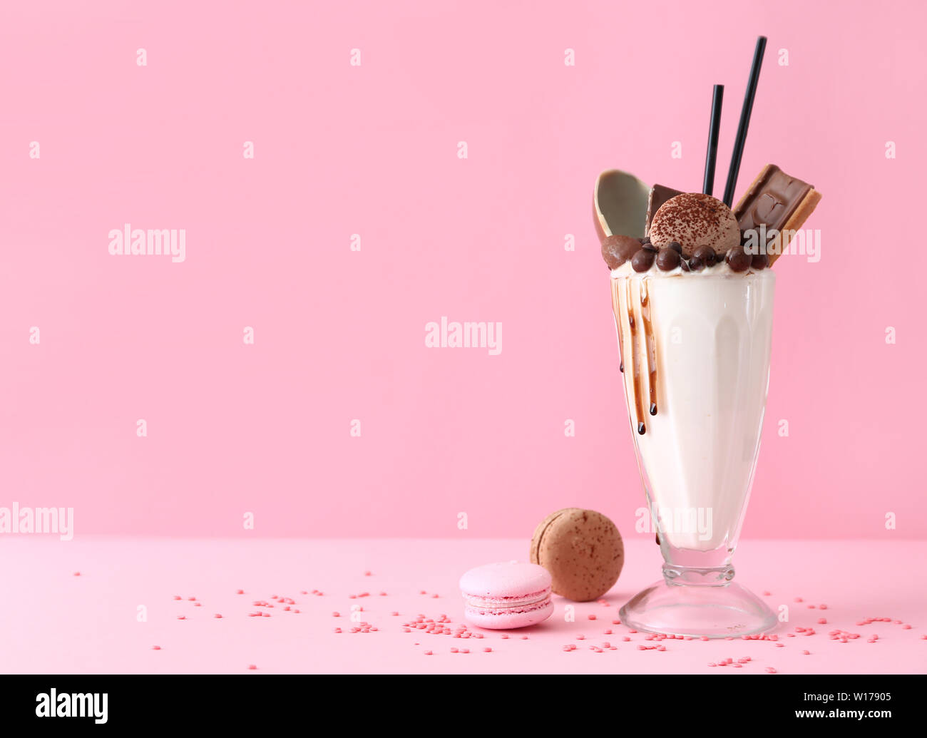 Delicious freak shake on color background Stock Photo - Alamy