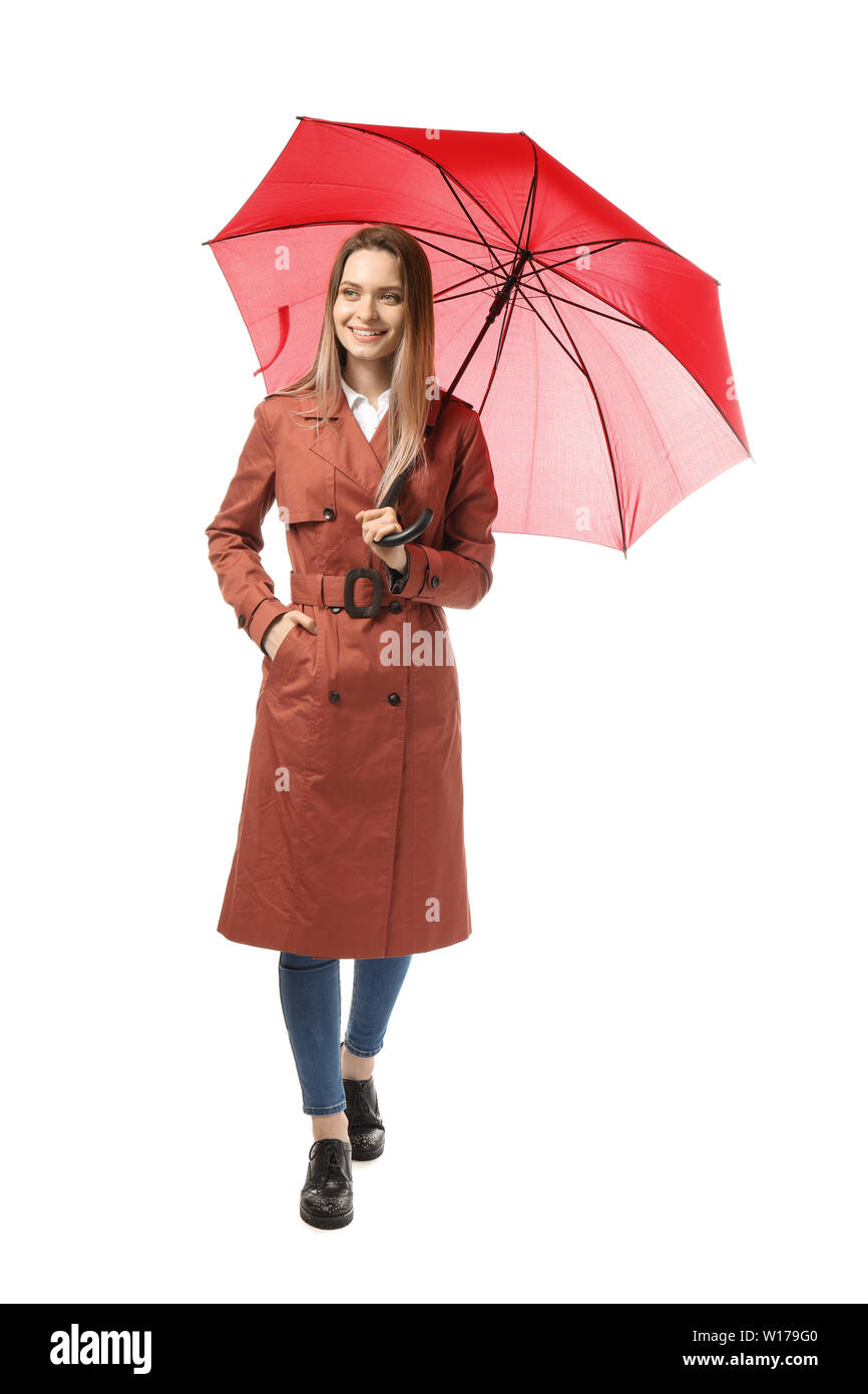 Beautiful young woman with umbrella on white background Stock Photo - Alamy