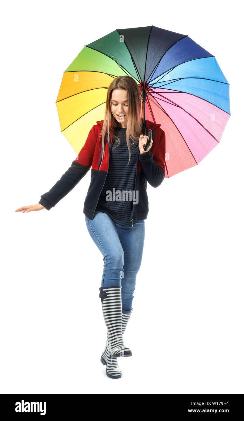 Beautiful young woman with umbrella on white background Stock Photo - Alamy