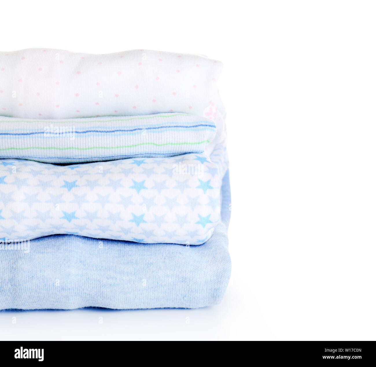 Stack of baby clothes on white background Stock Photo - Alamy