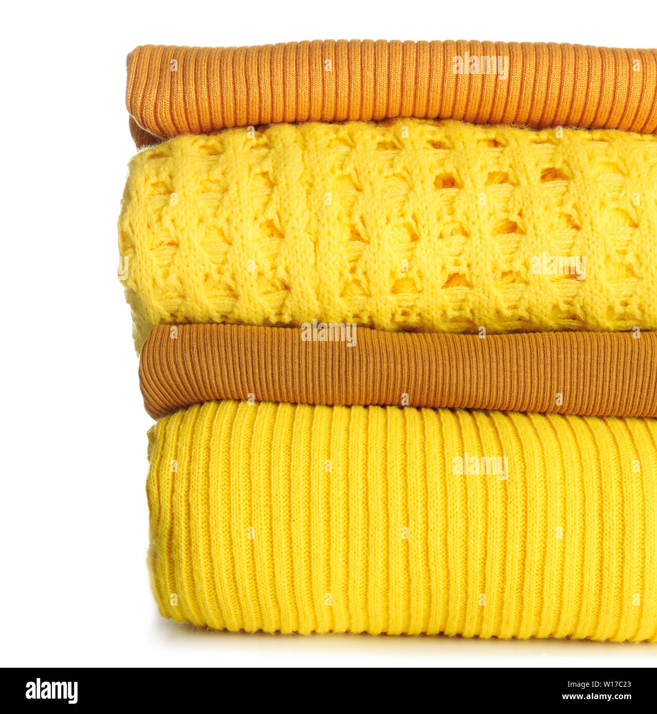 Stack of warm clothes on white background Stock Photo Alamy