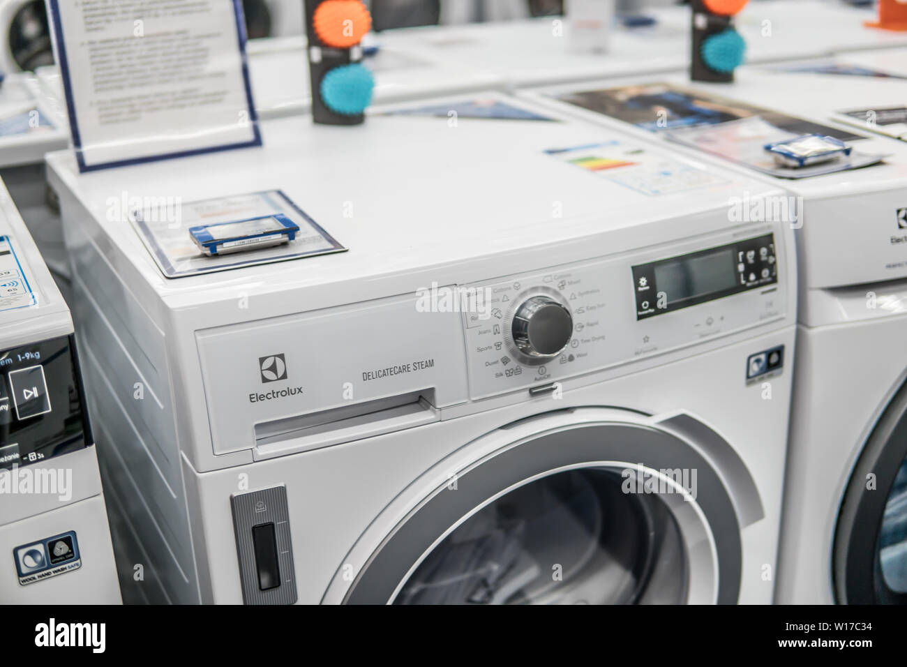 Lodz, Poland, July 2018 inside Saturn electronic store, free-standing Electrolux dryer washing machine on display for sale, produced by Electrolux, Stock Photo