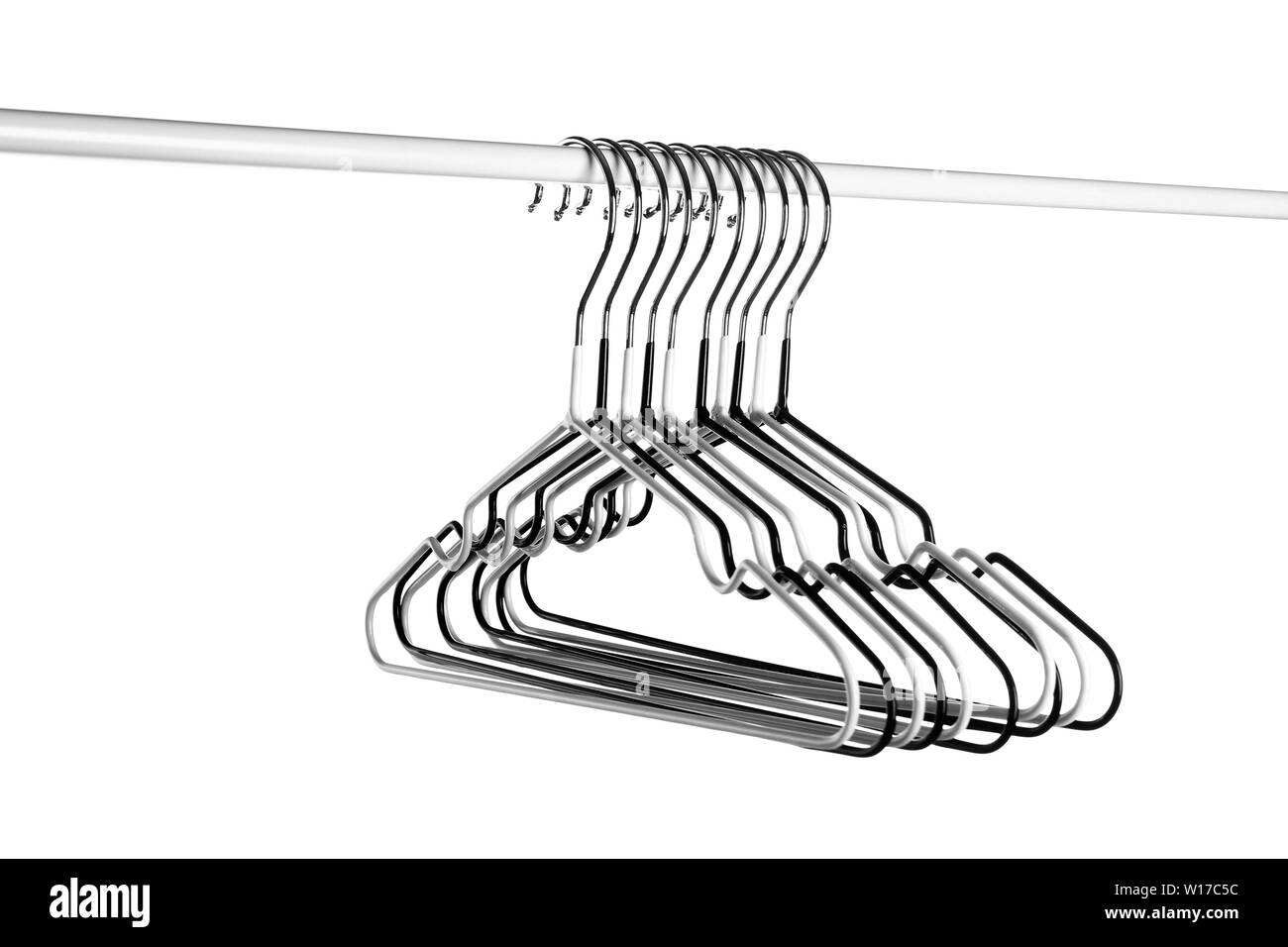 Rack with clothes hangers on white background Stock Photo