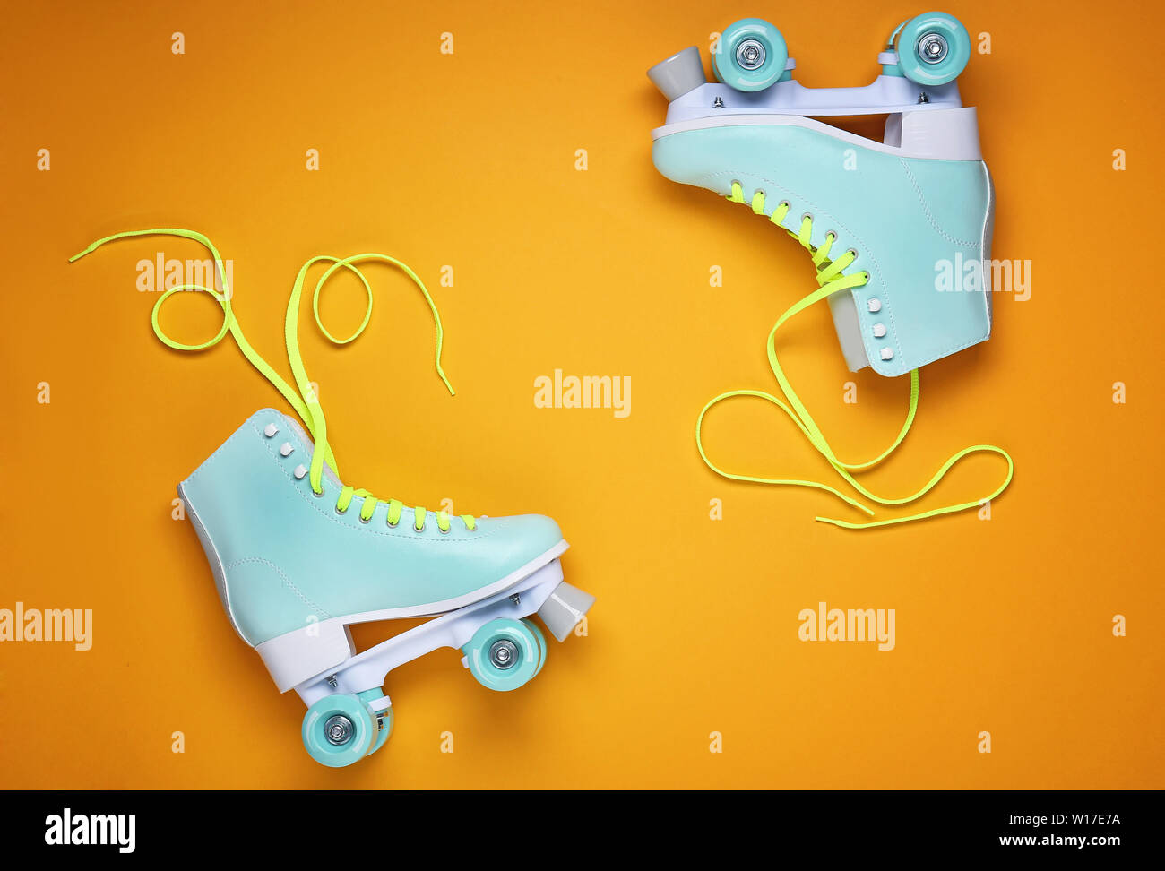 Vintage roller skates on color background Stock Photo - Alamy