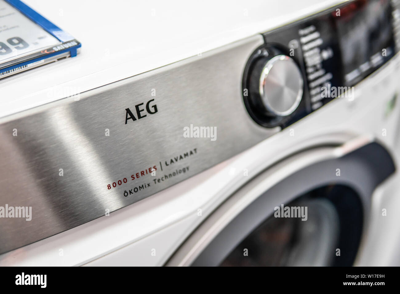 Lodz, Poland, July 2018 inside Saturn electronic store, free-standing AEG washing machine on display for sale, logo, brand name AEG Stock Photo