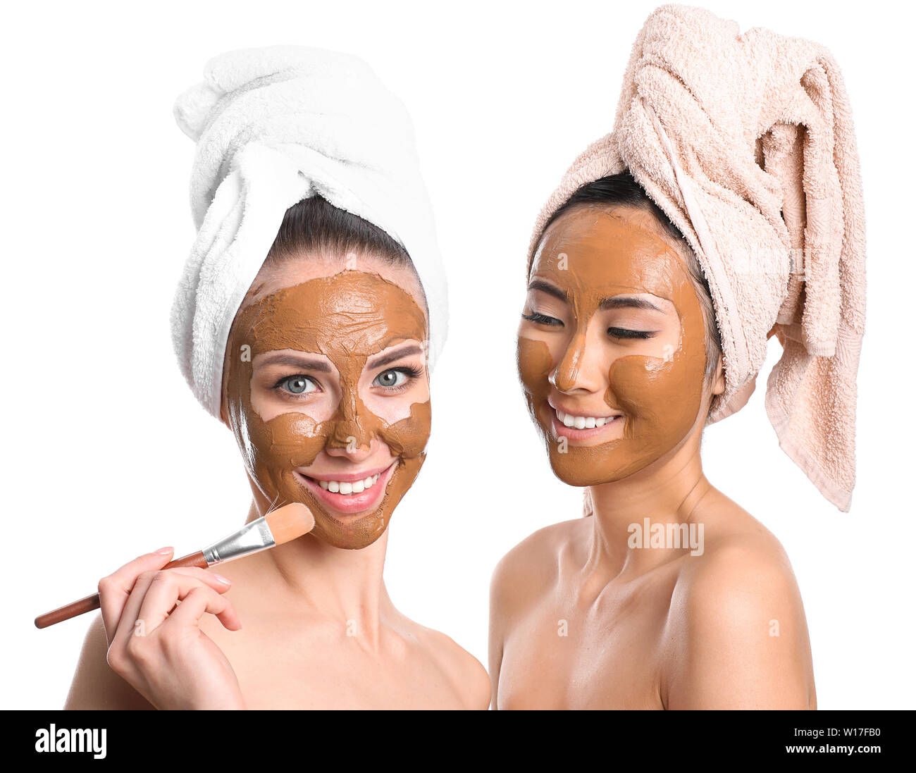 Beautiful women with facial masks on white background Stock Photo Alamy